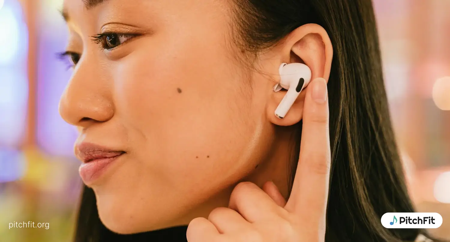 an asian woman wearing Apple airpods