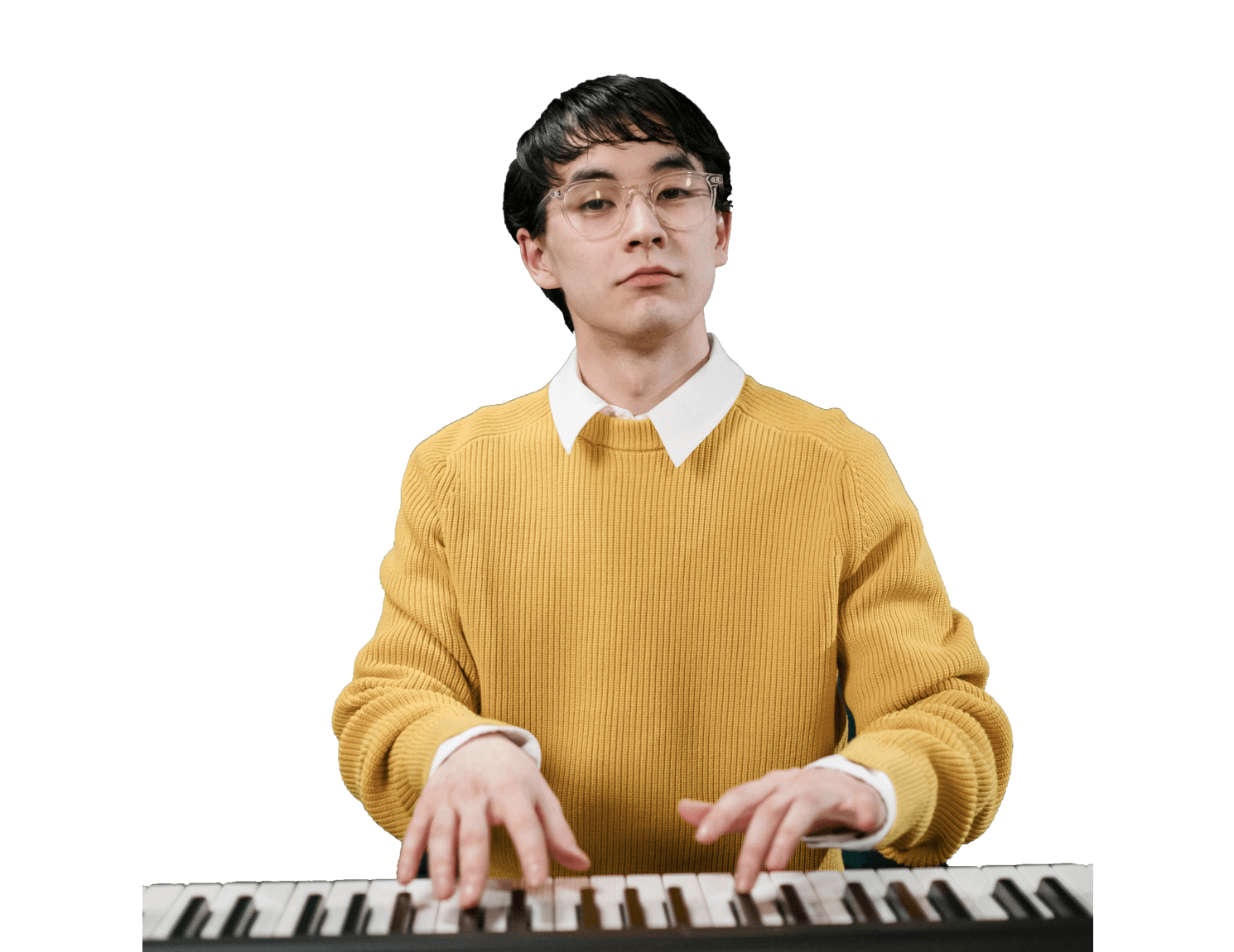 Man practicing on a keyboard, mastering piano techniques.