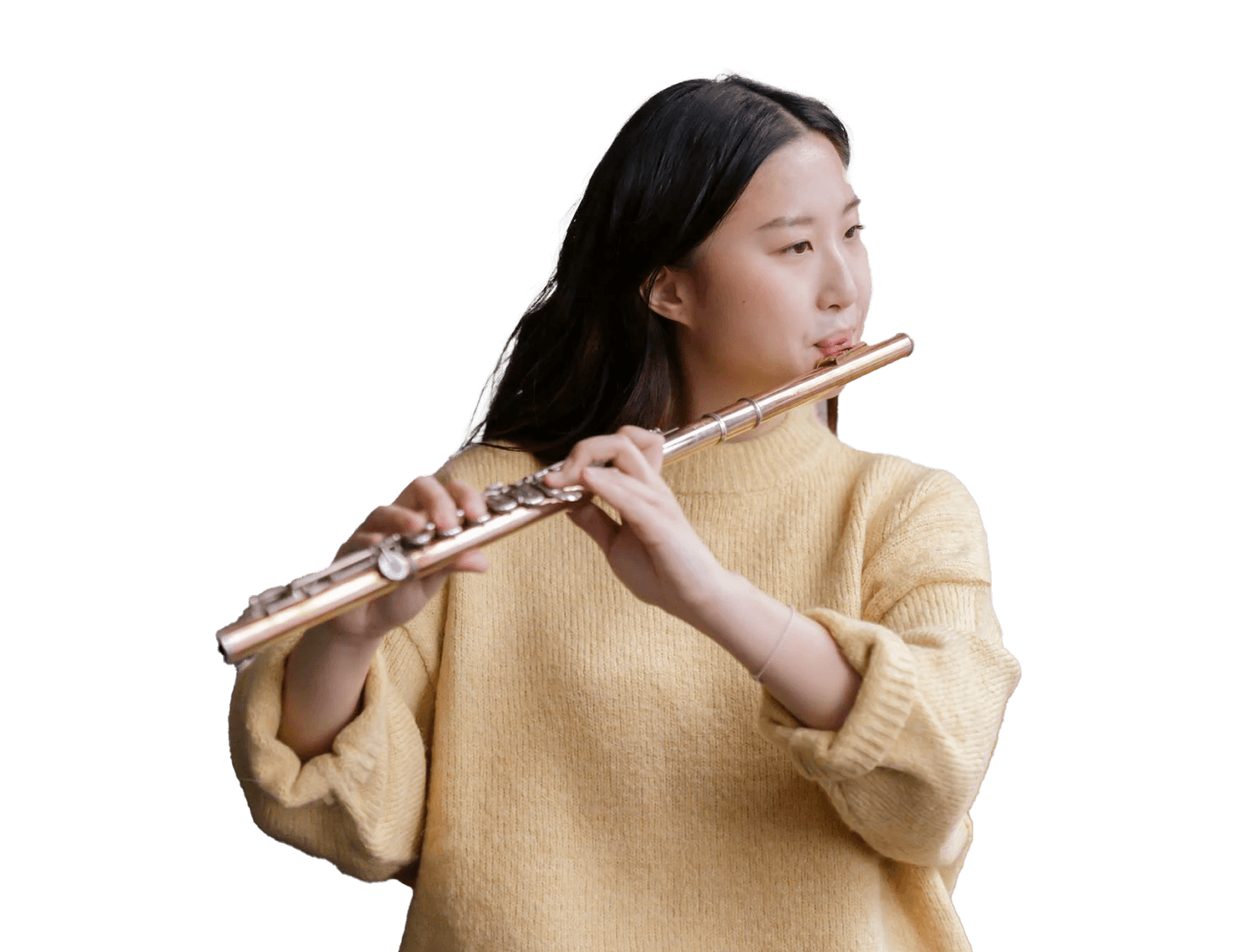 Woman playing flute, developing her ear training.